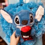 عروسک پولیشی وارداتی طرح استیچ گل به دست | Imported plush toy: Stitch holding a flower
